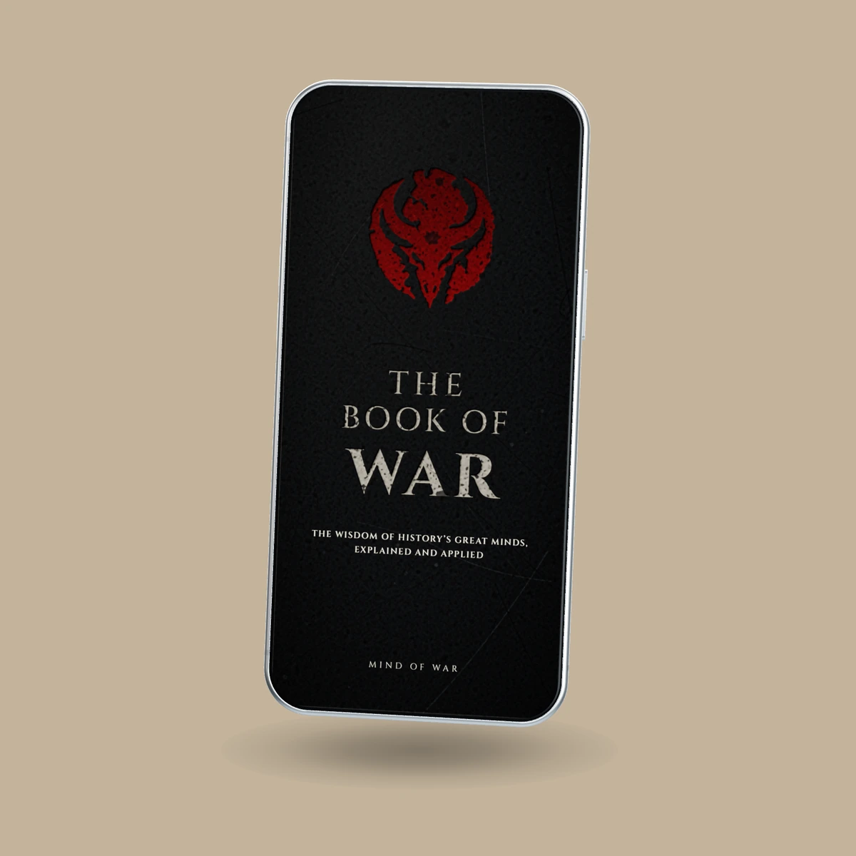 The Book of War second-edition cover on a phone angled slightly left, on a bronze background with a soft shadow beneath.